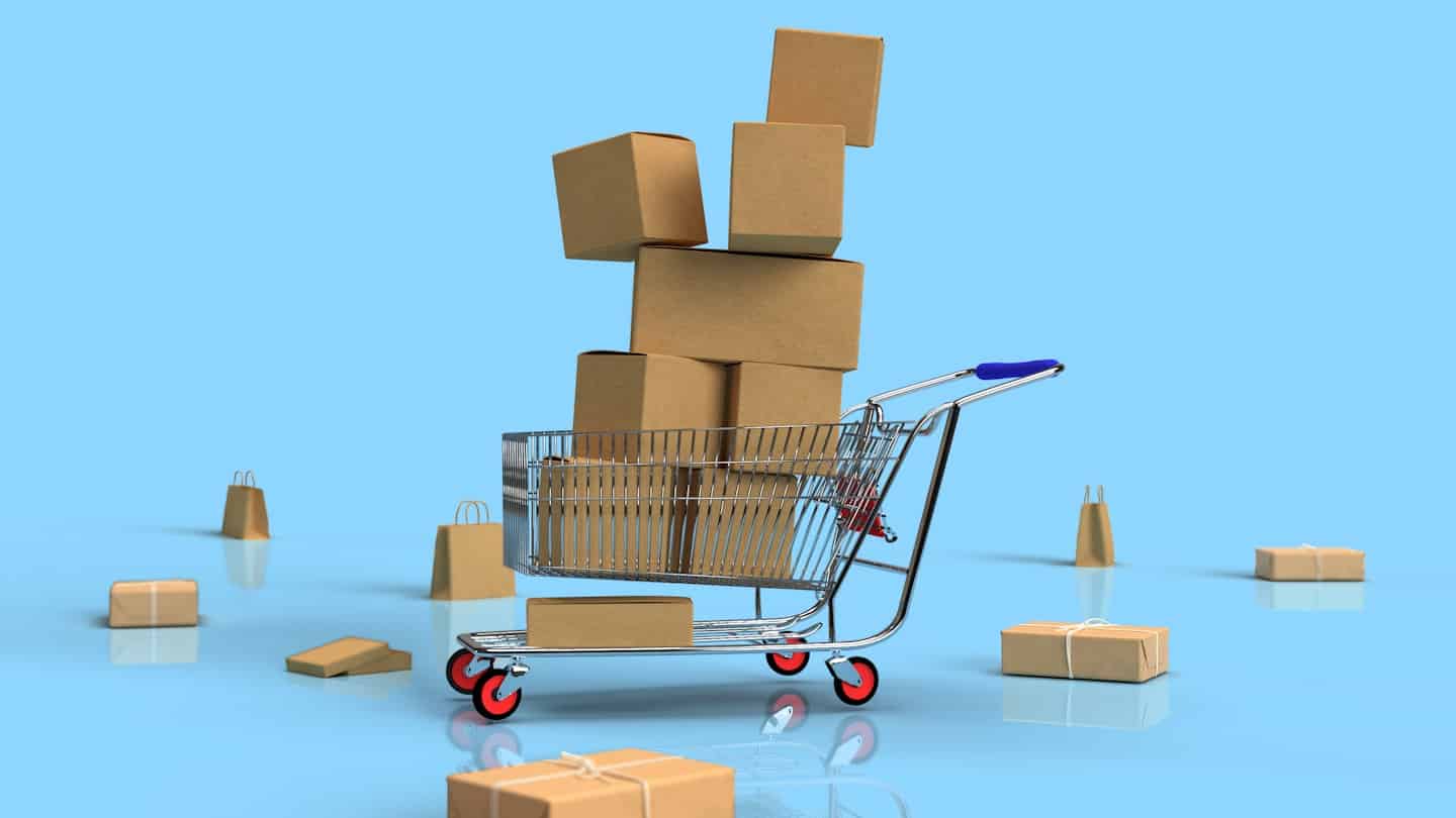 Image of a shopping cart with cardboard boxes and falling packages on a blue background.
